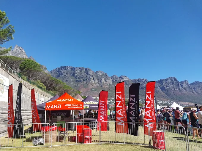 MANZI community water stand with Table Mountain in the background